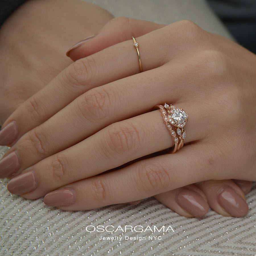 Rose gold engagement ring vintage inspired halo with a twist band in a hand