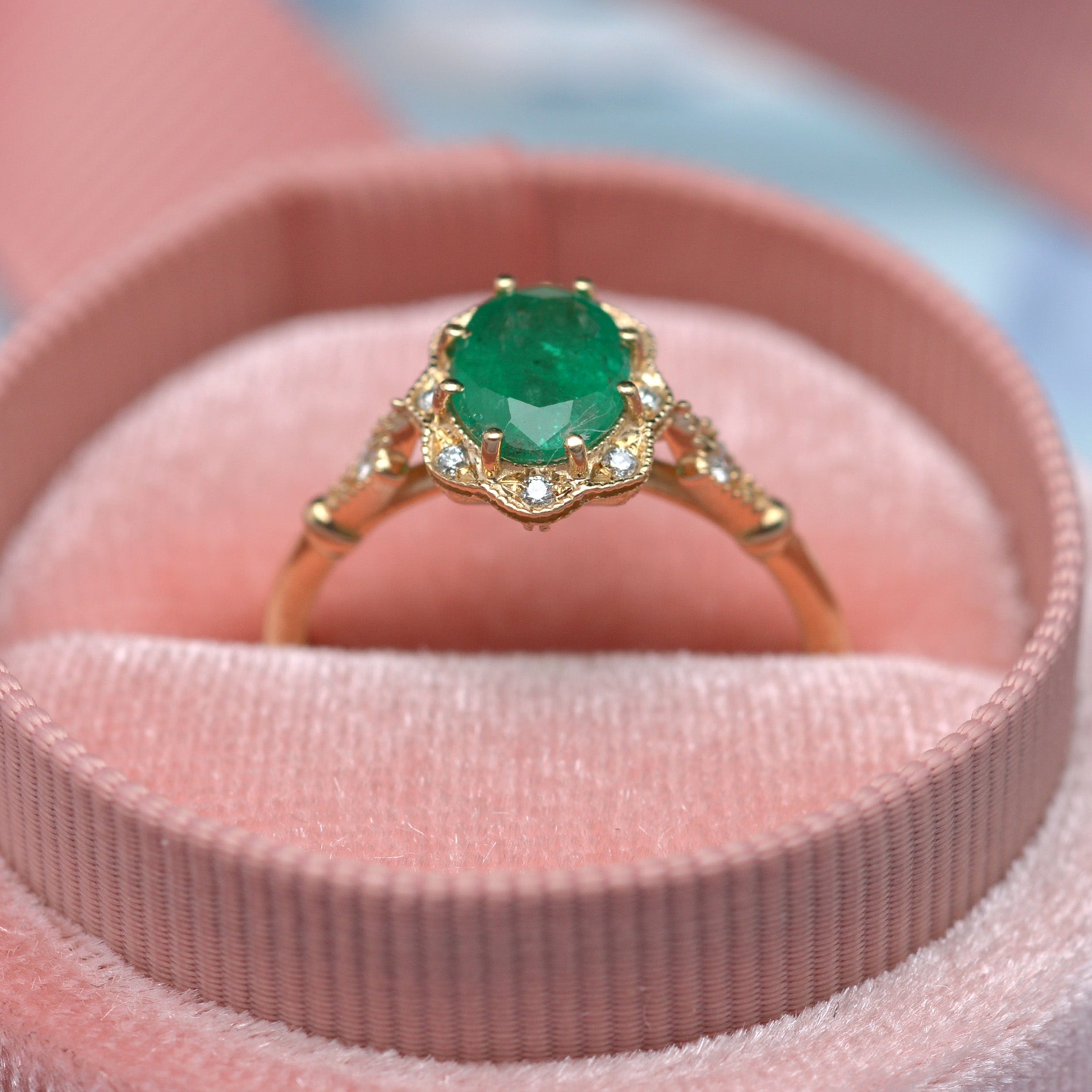 Natural oval green emerald engagement ring