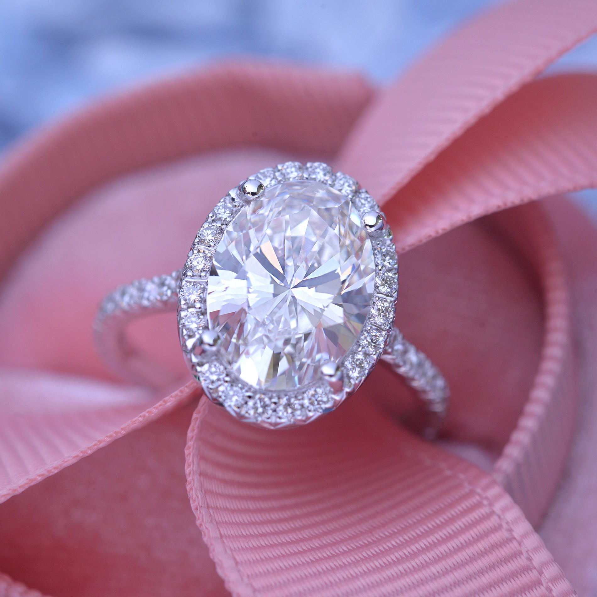 3 carat oval Halo engagement ring french cut pave in white gold with a lab grown diamond
