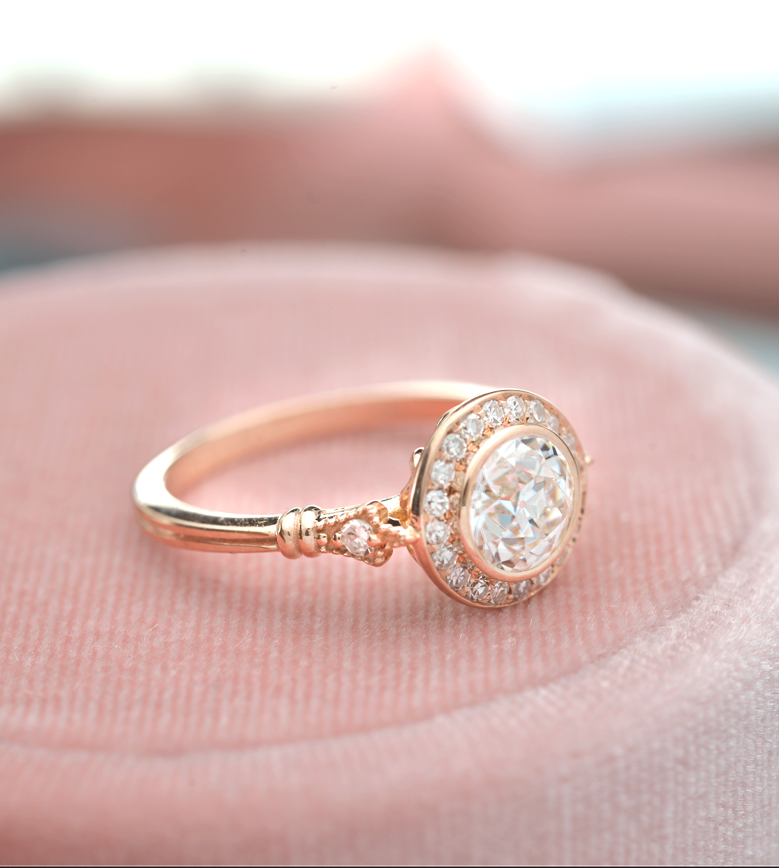 round bezel halo vintage look engagement ring in rose gold