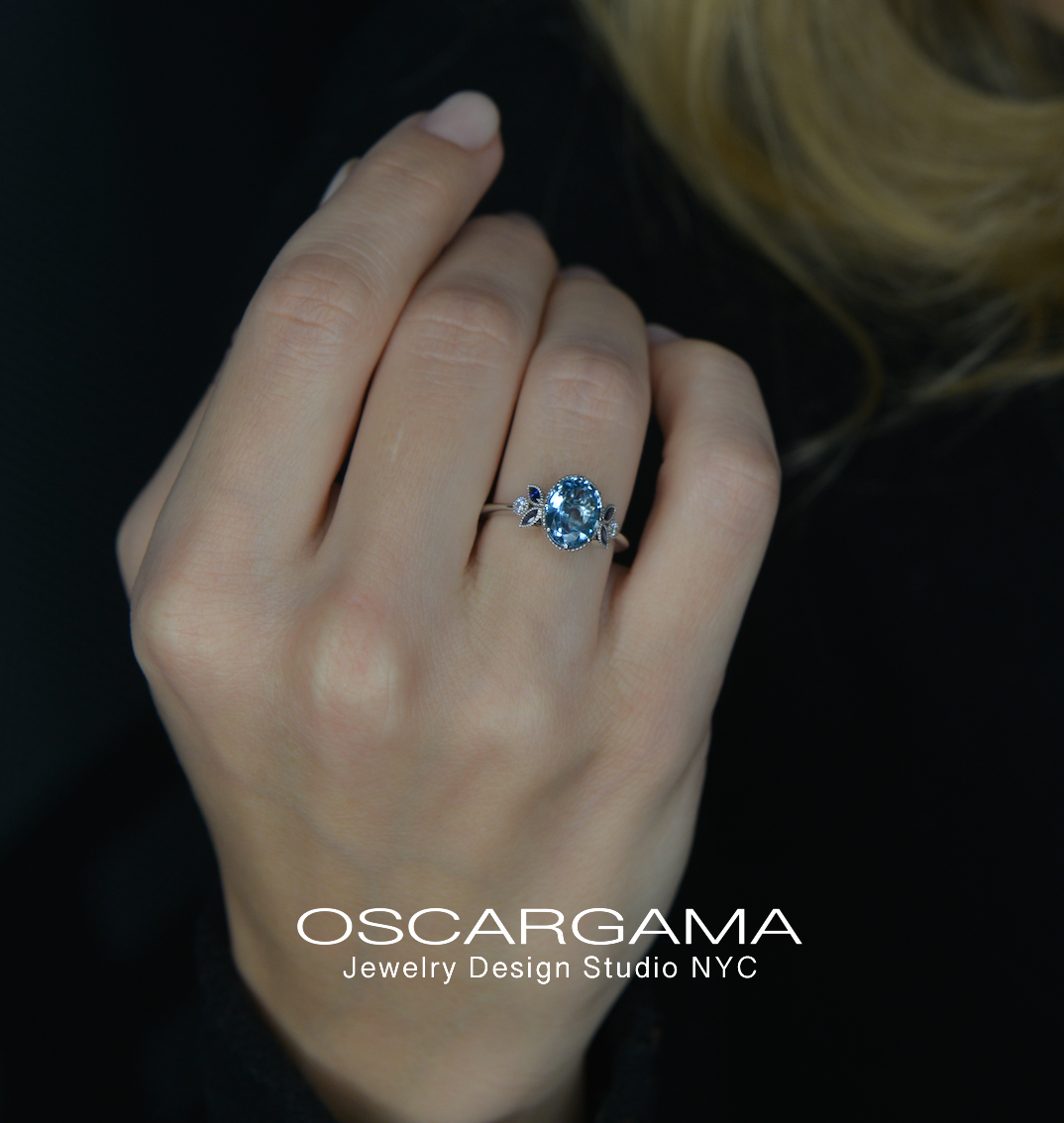 oval aqua marine ring in a model hand