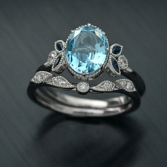 Ovaloval blue aqua marine engagement ring and band