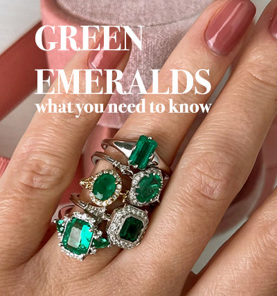 Gren emerald rings in a hand