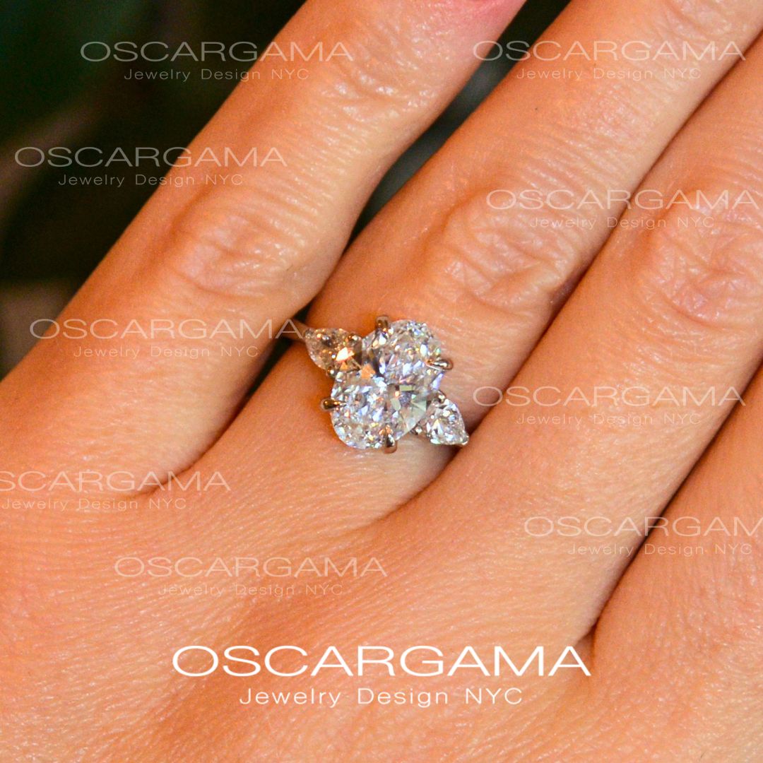 Classic 3 stone Oval with Pear Shape diamonds