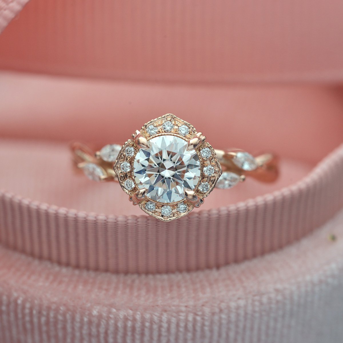 Rose gold engagement ring vintage inspired halo with a vine twist band