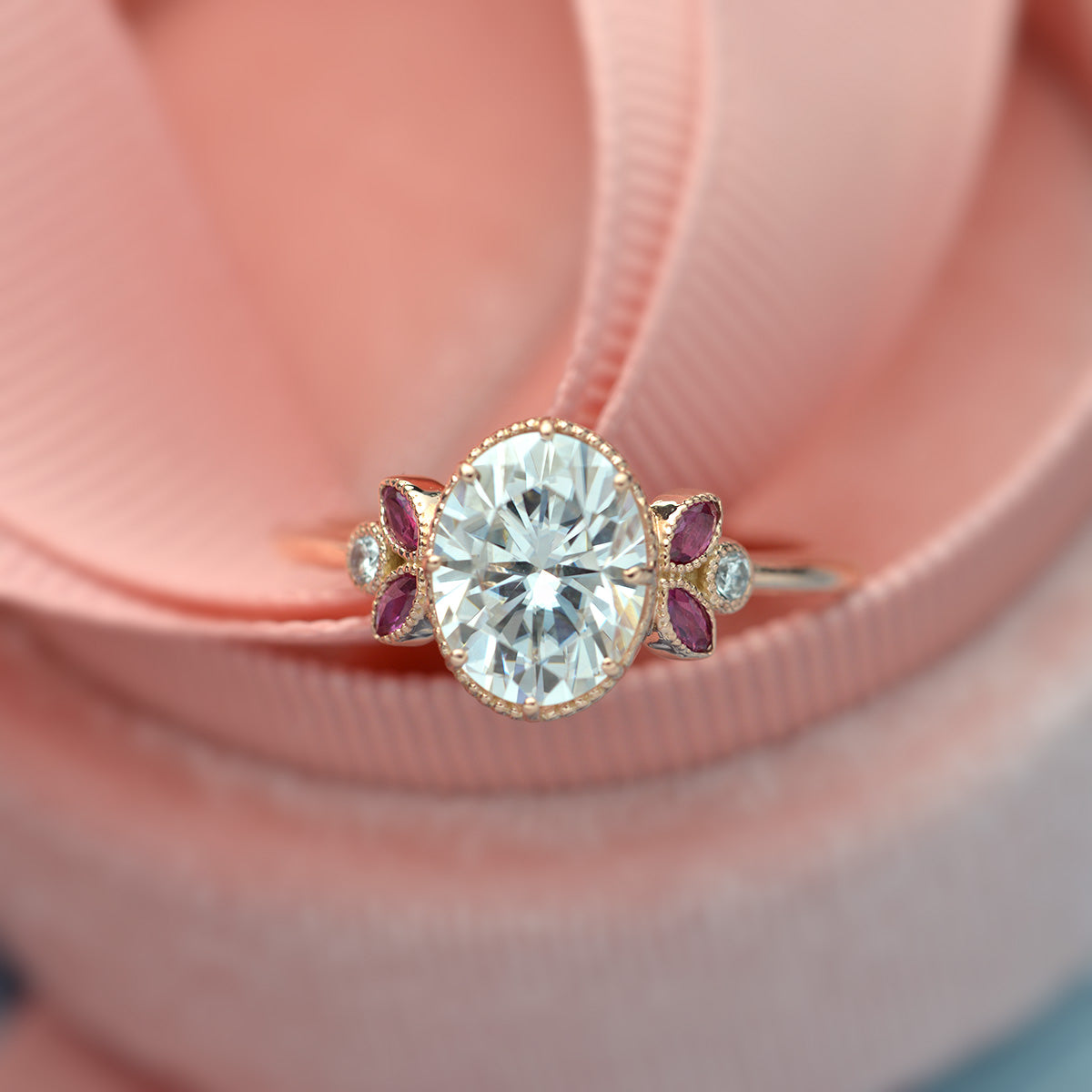 Oval engagement ring with marquise rubies in rose gold vintage inspired