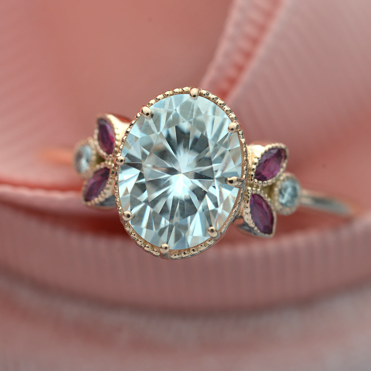 Oval engagement ring with marquise rubies in rose gold vintage inspired