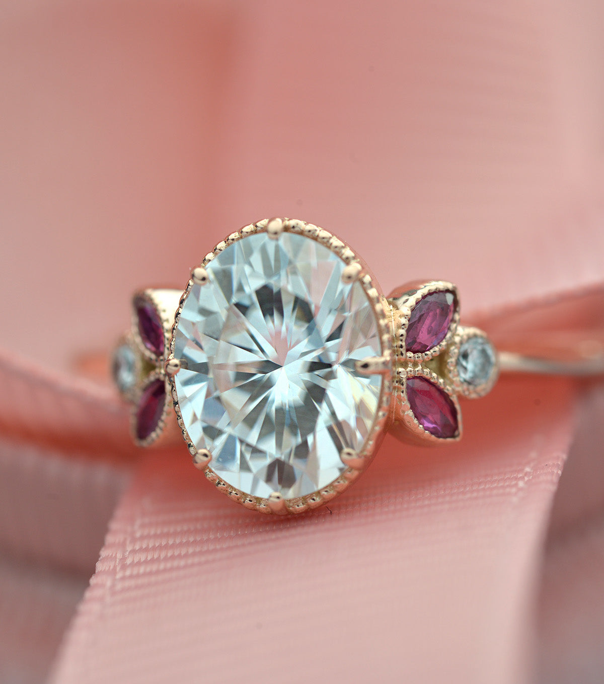 Oval engagement ring with marquise rubies in rose gold vintage inspired