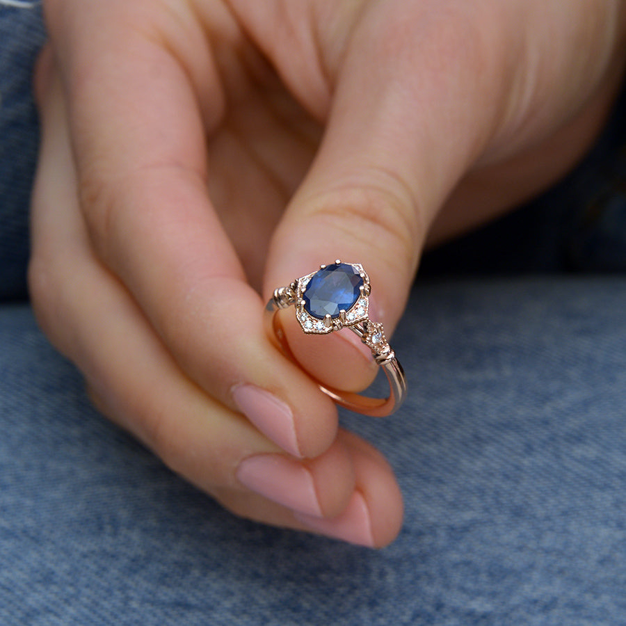 Blue Sapphire Vintage engagement Ring in hand