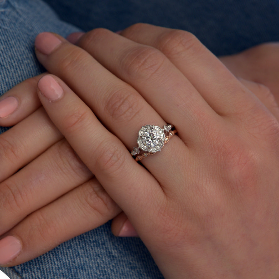 Lyzzy vintage inspired round engagement ring in white gold in a hand