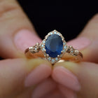 Blue Sapphire Vintage engagement Ring in hand