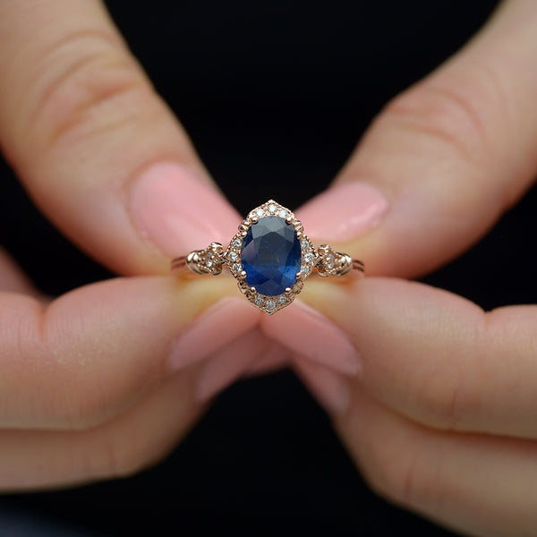 Blue Sapphire Vintage engagement Ring in hands