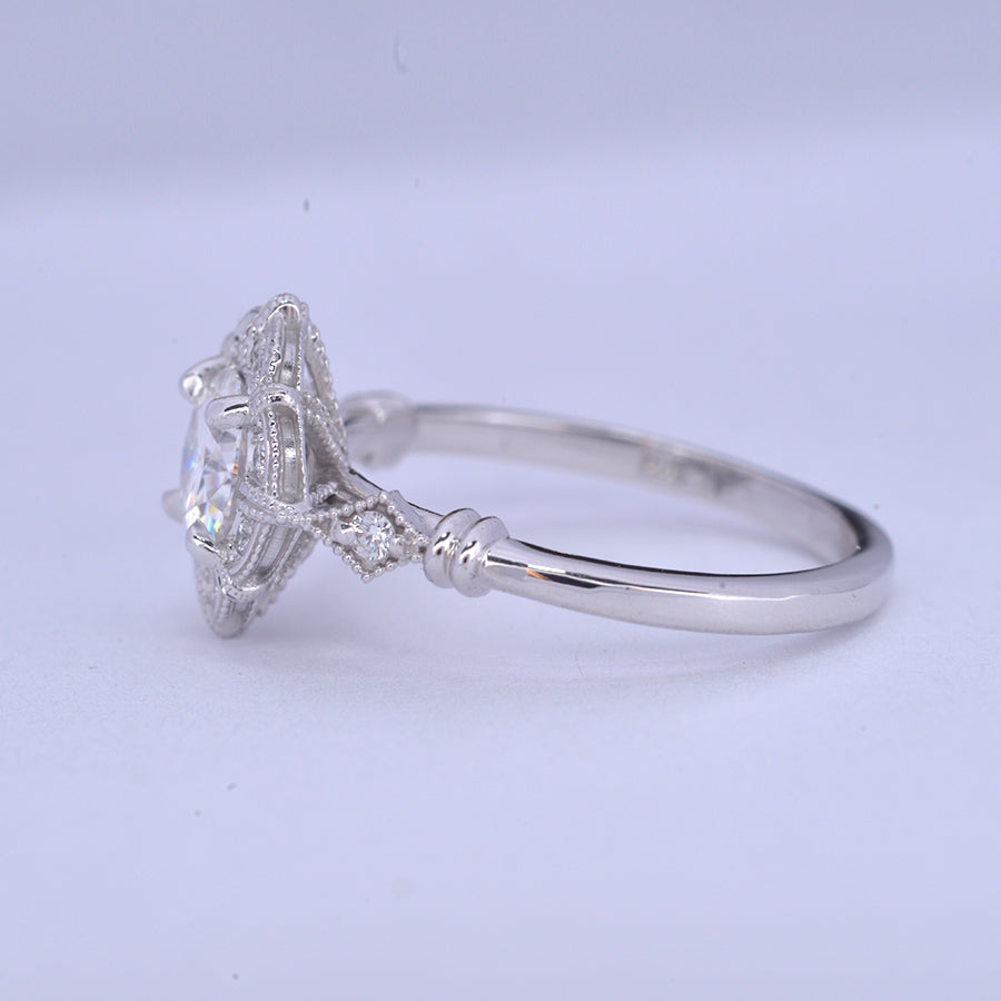 round halo vintage look engagement ring in withe gold