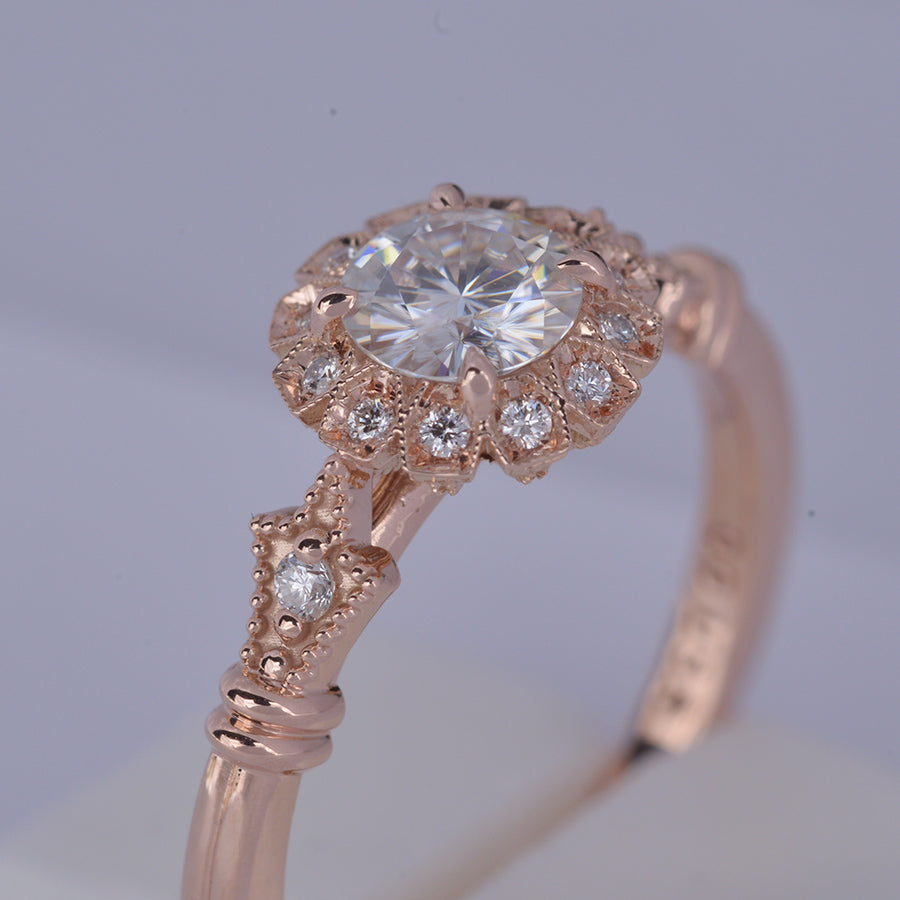 round halo vintage inspired engagement ring in rose gold  from the top