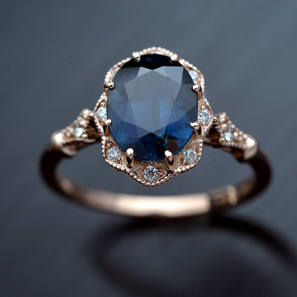 rose gold halo oval flower engagement ring vintage style with blue sapphire
