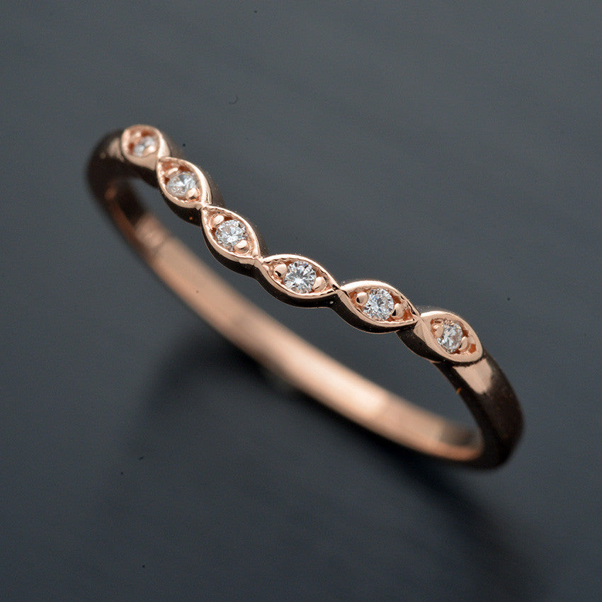 curved scalloped wedding band with 6 diamonds in rose gold