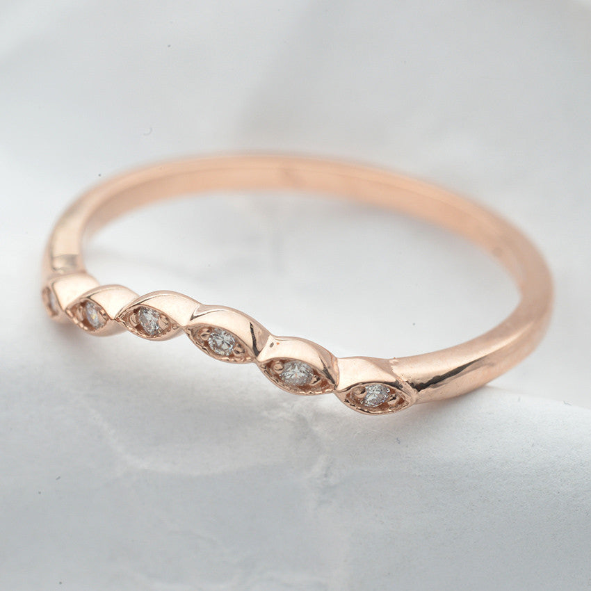 curved scalloped wedding band with 6 diamonds in rose gold