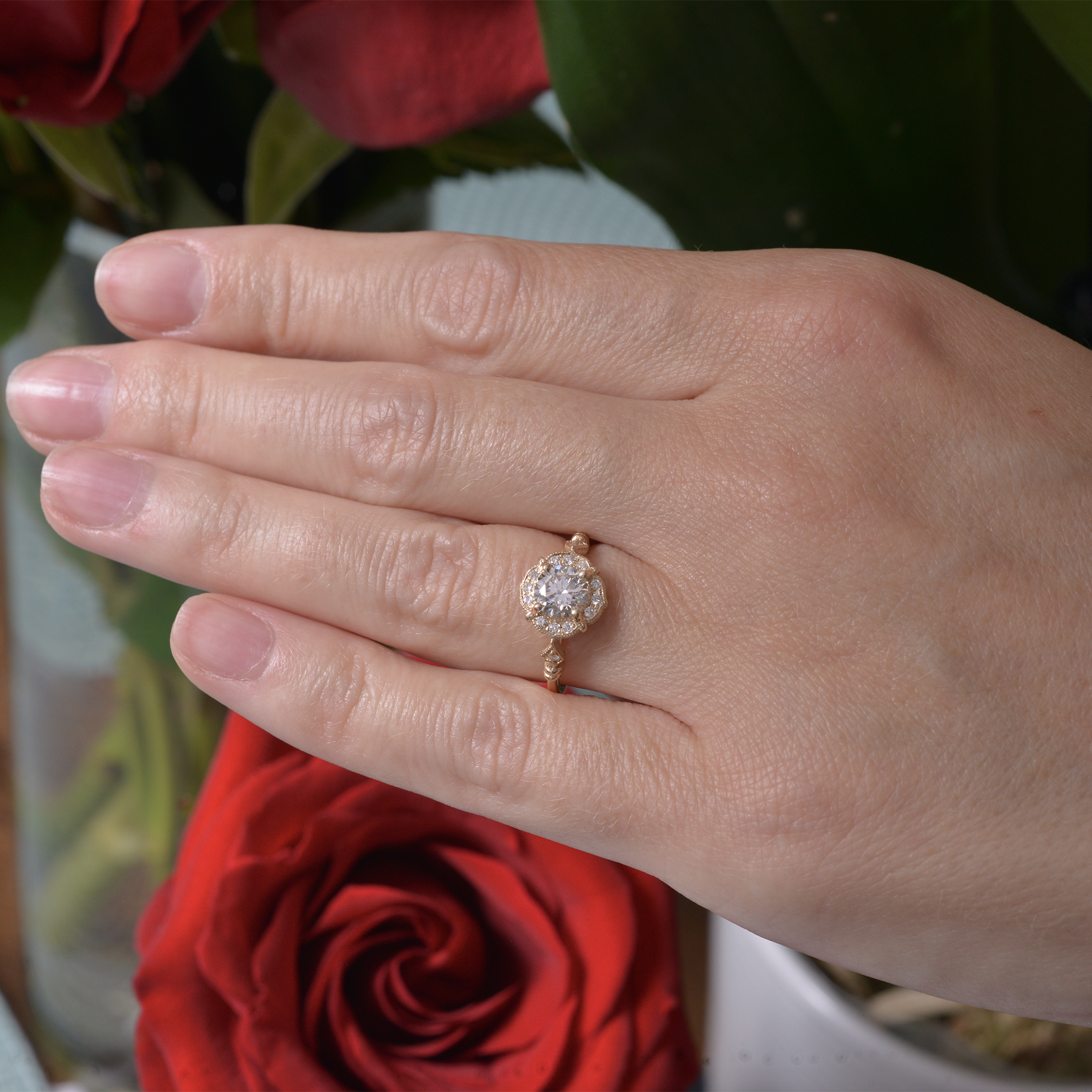 diamond engagement ring yellow gold in a hand