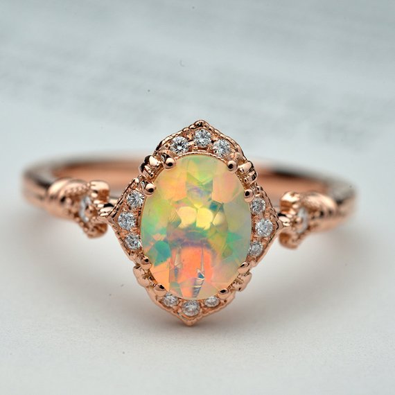 oval opal engagement ring in rose gold