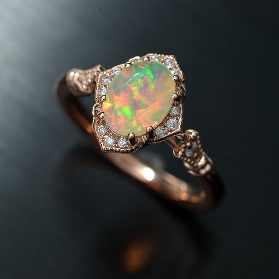 oval opal engagement ring in rose gold