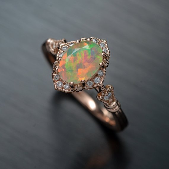 oval opal engagement ring in rose gold