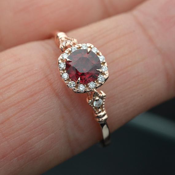 rose gold cushion halo engagement ring red garnet red center