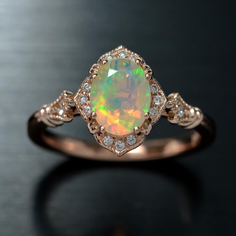 oval opal engagement ring in rose gold